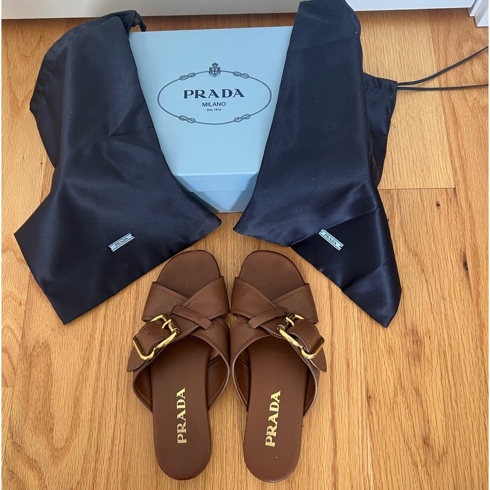 Prada slide sandals with gold buckle